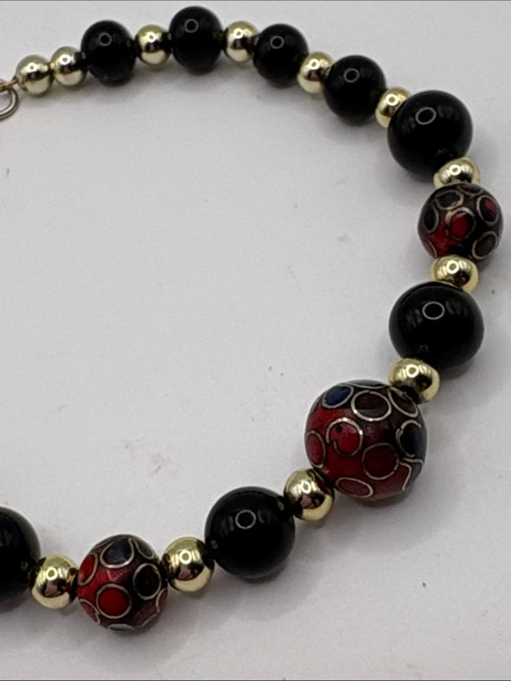 Gold Accent Black Bead Bracelet with Red Cloisonné Beads 7.5”